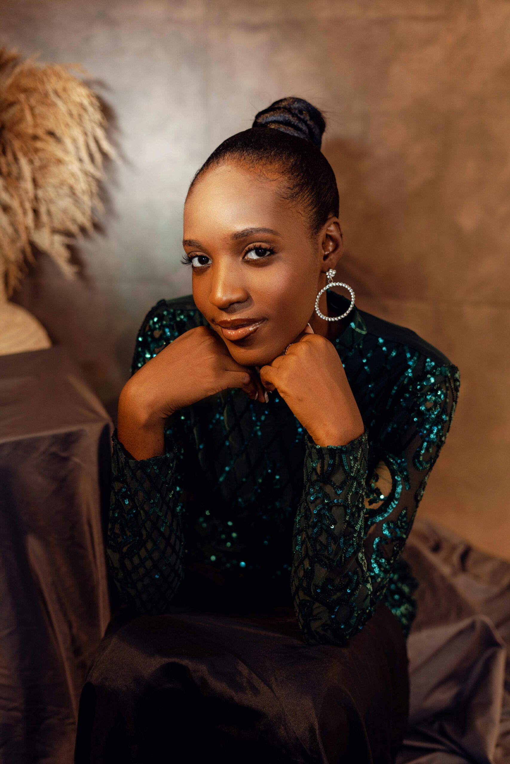 Stunning portrait of an African woman in glamorous attire, showcasing elegance and style.